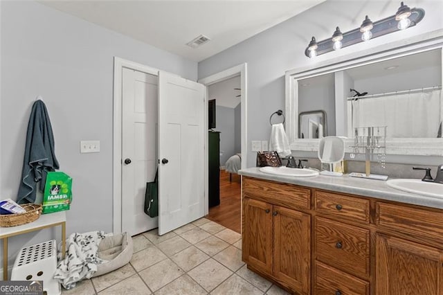 15 Baker St, Dahlonega, GA 30533 - bathroom featuring double vanity and tile patterned floors