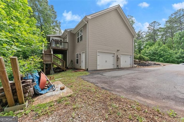 15 Baker St, Dahlonega, GA 30533 - view of home's exterior with a garage, driveway, stairs, and a deck