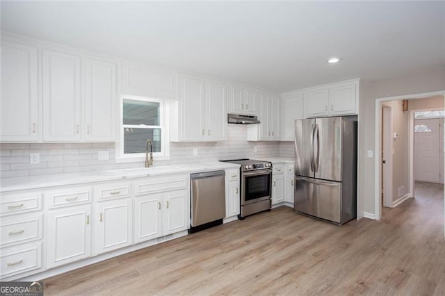 4806 Deer Chase, Powder Springs, GA 30127 - kitchen featuring stainless steel appliances, under cabinet range hood, white cabinets, tasteful backsplash, and recessed lighting