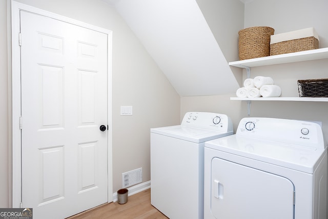 4806 Deer Chase, Powder Springs, GA 30127 - laundry area featuring washer and clothes dryer and light wood-type flooring