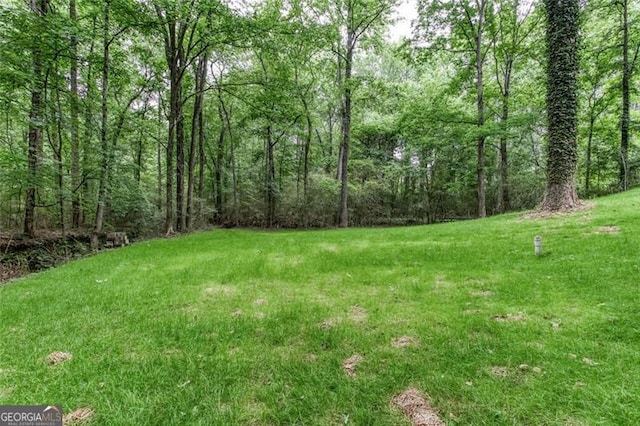 4806 Deer Chase, Powder Springs, GA 30127 - view of grassy yard with a wooded view