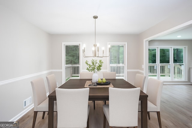 4806 Deer Chase, Powder Springs, GA 30127 - dining room featuring a chandelier, wood finished floors, and baseboards