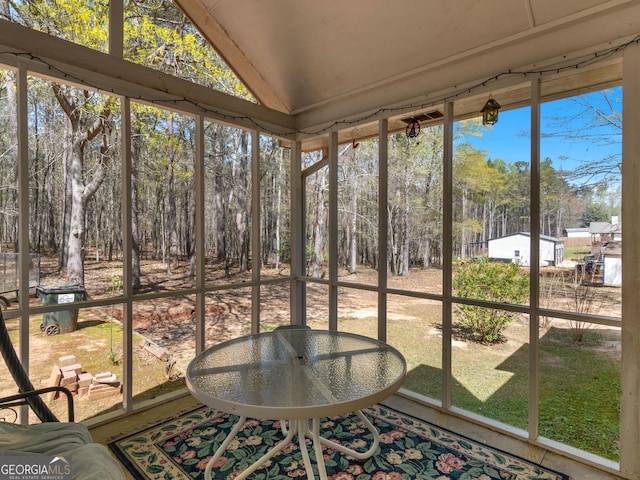 115 Christie Ln, Mcdonough, GA 30252 - sunroom / solarium featuring lofted ceiling and view of wooded area