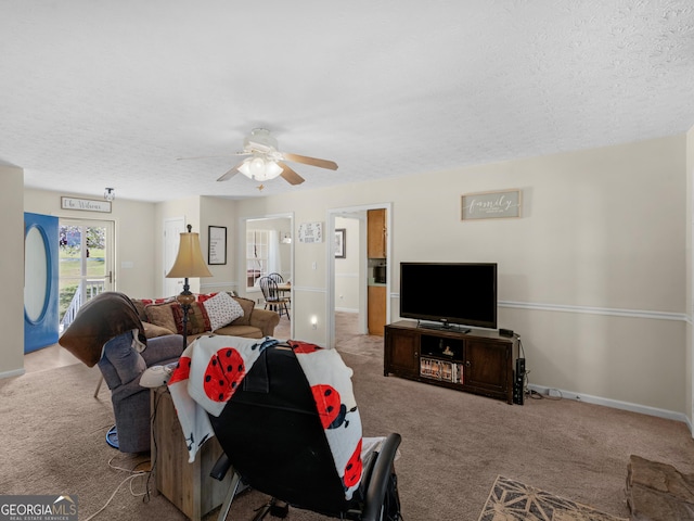 115 Christie Ln, Mcdonough, GA 30252 - carpeted living area featuring a textured ceiling, ceiling fan, and baseboards