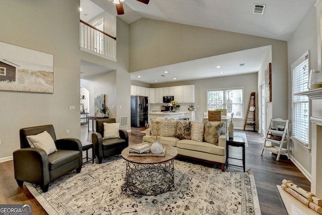 2633 Hanriva Ct, Dacula, GA 30019 - living area with a ceiling fan, dark wood-style flooring, baseboards, high vaulted ceiling, and recessed lighting