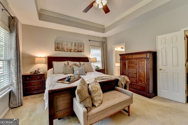 2633 Hanriva Ct, Dacula, GA 30019 - bedroom featuring light carpet, ornamental molding, ensuite bath, ceiling fan, and a raised ceiling