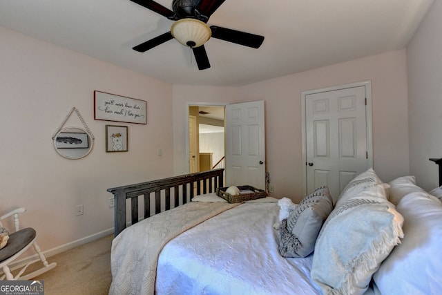 2633 Hanriva Ct, Dacula, GA 30019 - bedroom featuring light colored carpet, a ceiling fan, and baseboards