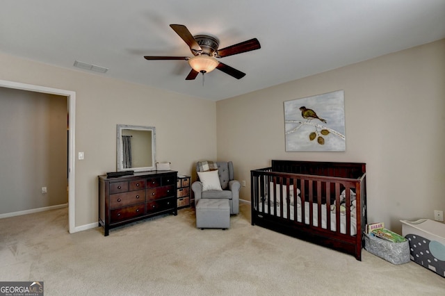 2633 Hanriva Ct, Dacula, GA 30019 - bedroom featuring carpet, ceiling fan, baseboards, and a crib