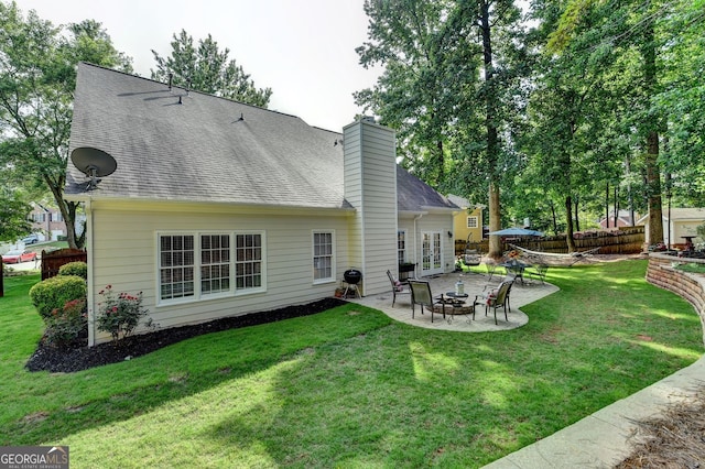 2633 Hanriva Ct, Dacula, GA 30019 - back of house featuring a patio area, french doors, a chimney, and roof with shingles