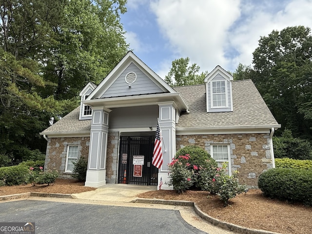 2633 Hanriva Ct, Dacula, GA 30019 - view of front facade with roof with shingles, stone siding, and a garage
