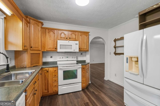 2644 Hickory Valley Dr, Snellville, GA 30078 - kitchen featuring white appliances, open shelves, arched walkways, dark wood-style flooring, and ornamental molding