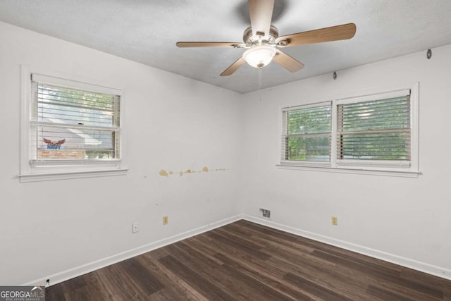 2644 Hickory Valley Dr, Snellville, GA 30078 - empty room with dark wood-type flooring and a ceiling fan