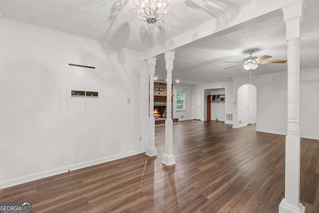 2644 Hickory Valley Dr, Snellville, GA 30078 - unfurnished living room featuring ceiling fan, wood finished floors, a fireplace, and a textured ceiling