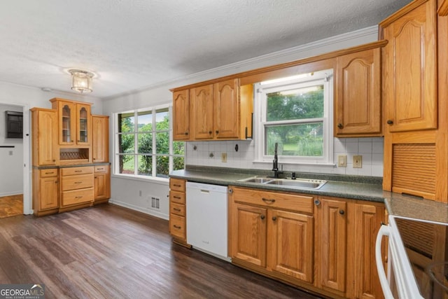 2644 Hickory Valley Dr, Snellville, GA 30078 - kitchen with white dishwasher, range, tasteful backsplash, dark wood-type flooring, and crown molding