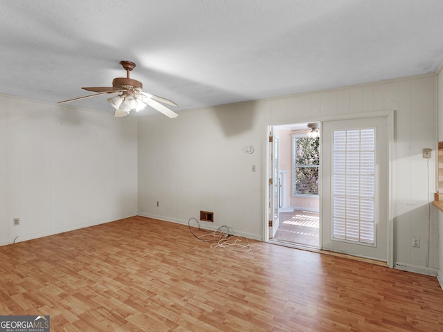 1727 Briarcliff Rd, Milledgeville, GA 31061 - unfurnished room featuring light wood-style flooring, a ceiling fan, and a textured ceiling