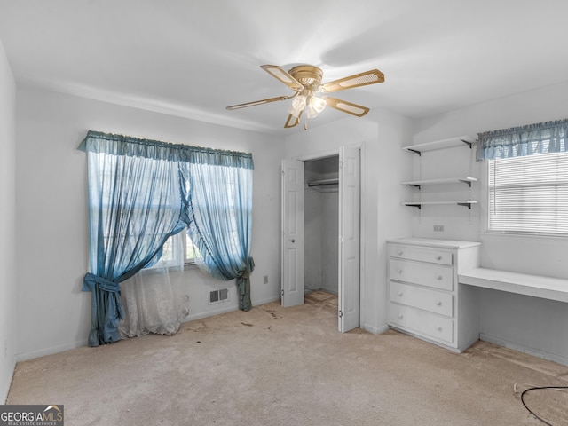 1727 Briarcliff Rd, Milledgeville, GA 31061 - unfurnished bedroom with light colored carpet, multiple windows, a closet, and a ceiling fan