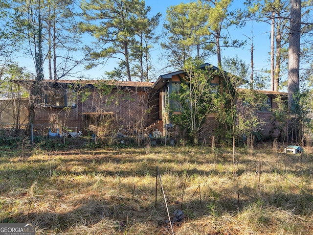 1727 Briarcliff Rd, Milledgeville, GA 31061 - back of house featuring brick siding