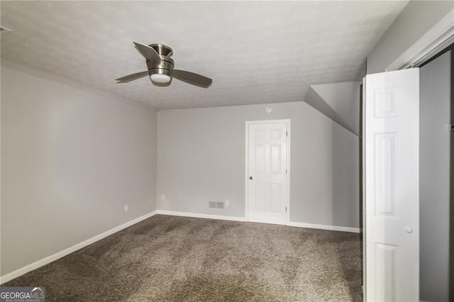 4820 Camden Dr SW, Conyers, GA 30094 - bonus room featuring dark carpet, a ceiling fan, and baseboards