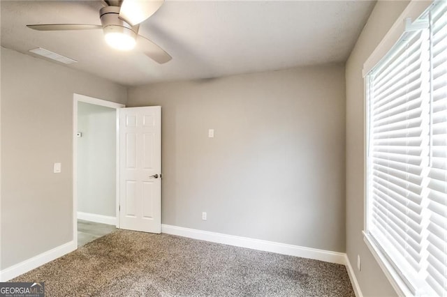 4820 Camden Dr SW, Conyers, GA 30094 - carpeted empty room featuring a ceiling fan and baseboards