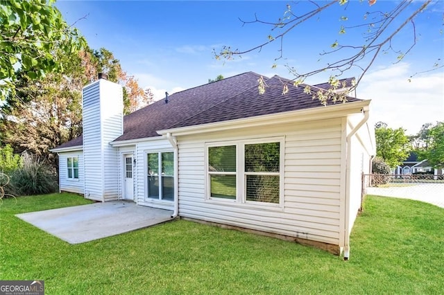 4820 Camden Dr SW, Conyers, GA 30094 - back of property featuring a patio area, roof with shingles, and a chimney