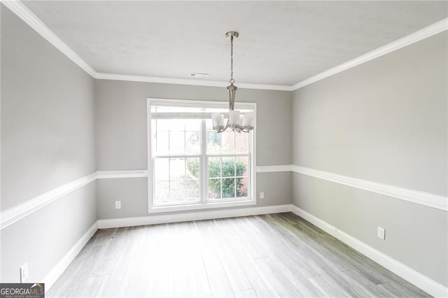 4820 Camden Dr SW, Conyers, GA 30094 - unfurnished room featuring a chandelier, wood finished floors, baseboards, and crown molding