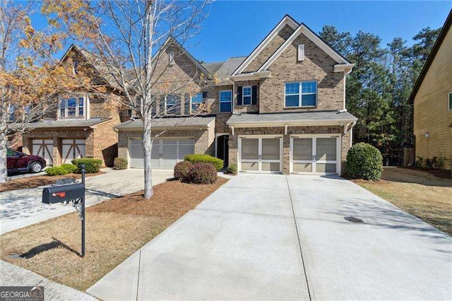 6160 Shiloh Woods Dr, Cumming, GA 30040 - view of front of house with concrete driveway, a garage, and brick siding