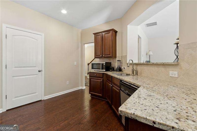 6160 Shiloh Woods Dr, Cumming, GA 30040 - kitchen featuring a sink, stainless steel microwave, dishwashing machine, decorative backsplash, and dark wood finished floors