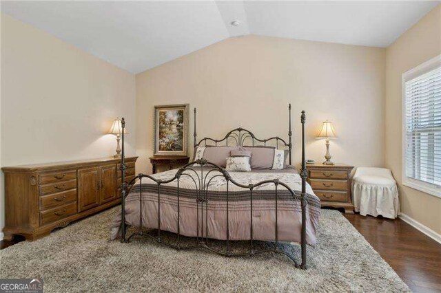 6160 Shiloh Woods Dr, Cumming, GA 30040 - bedroom with lofted ceiling, wood finished floors, and baseboards