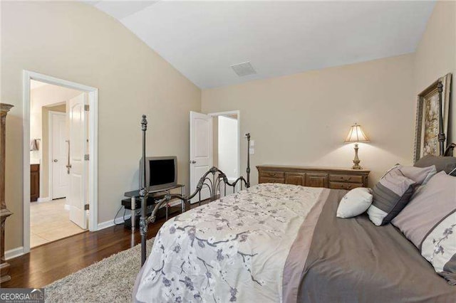 6160 Shiloh Woods Dr, Cumming, GA 30040 - bedroom with vaulted ceiling, wood finished floors, and baseboards