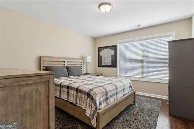 6160 Shiloh Woods Dr, Cumming, GA 30040 - bedroom featuring multiple windows, dark wood-style floors, and baseboards
