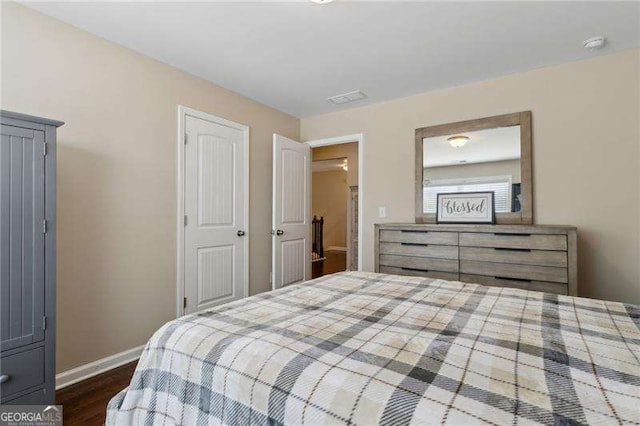 6160 Shiloh Woods Dr, Cumming, GA 30040 - bedroom featuring baseboards and dark wood-type flooring