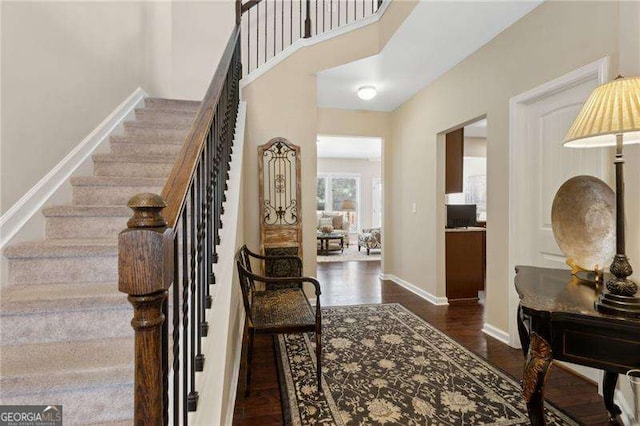 6160 Shiloh Woods Dr, Cumming, GA 30040 - stairs with wood finished floors, baseboards, and a high ceiling