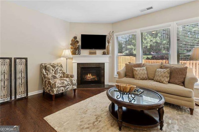 6160 Shiloh Woods Dr, Cumming, GA 30040 - living area with wood finished floors, a glass covered fireplace, and baseboards