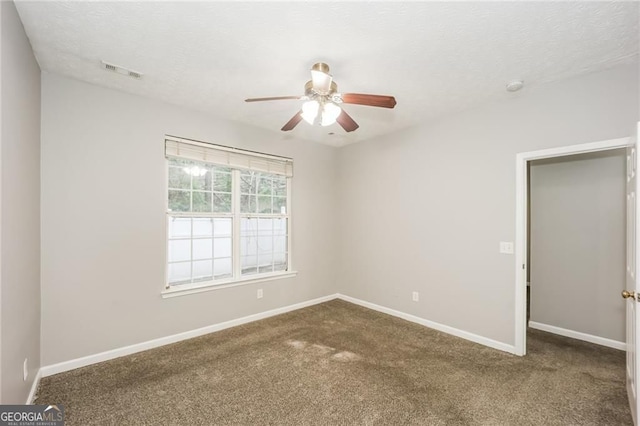 6073 Camden Forrest Dr, Riverdale, GA 30296 - carpeted empty room with a ceiling fan, a smoke detector, and a textured ceiling