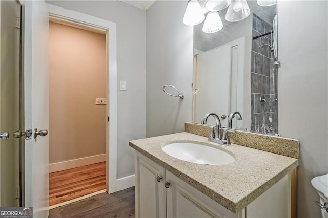 4309 Gilbert Pl, Forest Park, GA 30297 - bathroom featuring vanity, wood finished floors, baseboards, and toilet