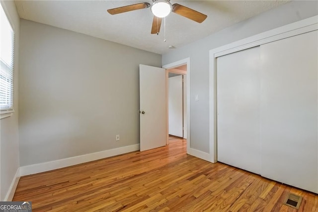4309 Gilbert Pl, Forest Park, GA 30297 - unfurnished bedroom with light wood-type flooring, a closet, and baseboards