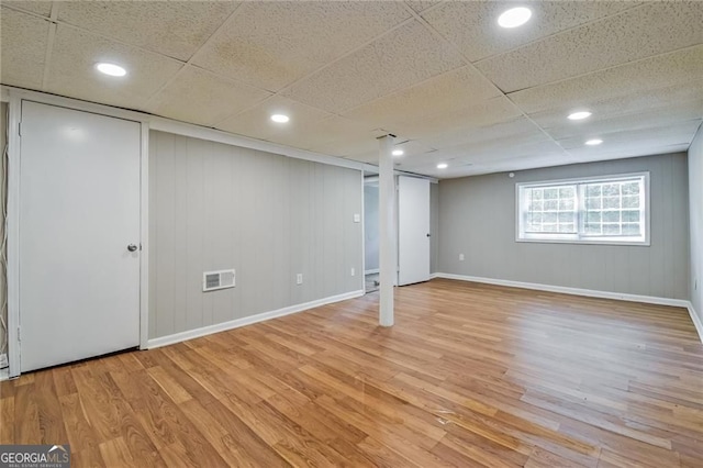4309 Gilbert Pl, Forest Park, GA 30297 - basement featuring light wood-type flooring, baseboards, recessed lighting, and a drop ceiling