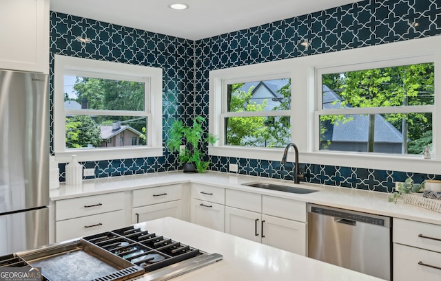 1168 Mclynn Ave NE, Atlanta, GA 30306 - kitchen with appliances with stainless steel finishes, decorative backsplash, white cabinets, light countertops, and recessed lighting