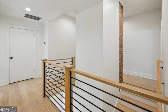 1168 Mclynn Ave NE, Atlanta, GA 30306 - hallway with an upstairs landing, light wood-type flooring, and recessed lighting