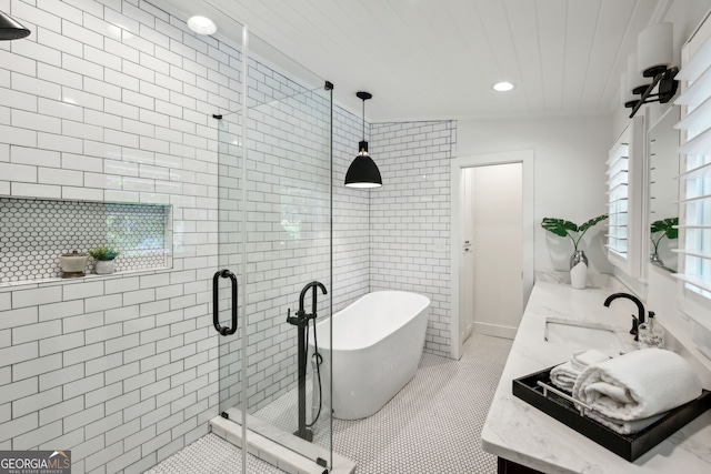 1168 Mclynn Ave NE, Atlanta, GA 30306 - bathroom featuring vanity, a freestanding tub, a shower stall, tile patterned flooring, and recessed lighting
