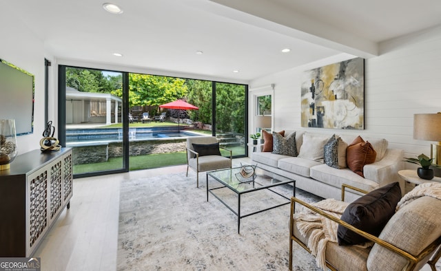 1168 Mclynn Ave NE, Atlanta, GA 30306 - living area with plenty of natural light, wood finished floors, expansive windows, and recessed lighting