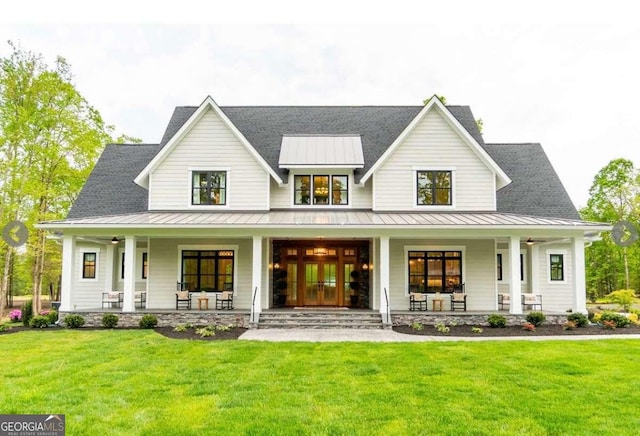 1278 Mulberry, Commerce, GA 30530 - modern inspired farmhouse featuring a standing seam roof, covered porch, a front lawn, and metal roof