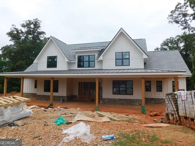 1278 Mulberry, Commerce, GA 30530 - modern farmhouse with a standing seam roof, board and batten siding, roof with shingles, and brick siding