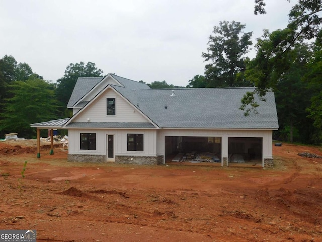 1278 Mulberry, Commerce, GA 30530 - view of front facade featuring a garage, a shingled roof, stone siding, and driveway