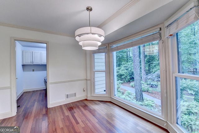 5507 Martina Way, Dunwoody, GA 30338 - unfurnished dining area featuring hardwood / wood-style floors and ornamental molding