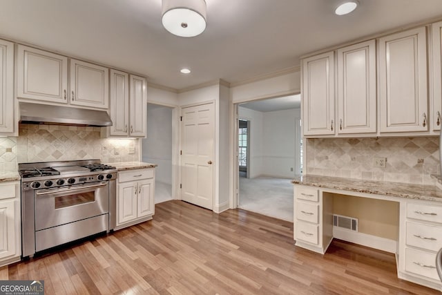 5507 Martina Way, Dunwoody, GA 30338 - kitchen featuring high end stainless steel range oven, under cabinet range hood, light wood-type flooring, baseboards, and recessed lighting