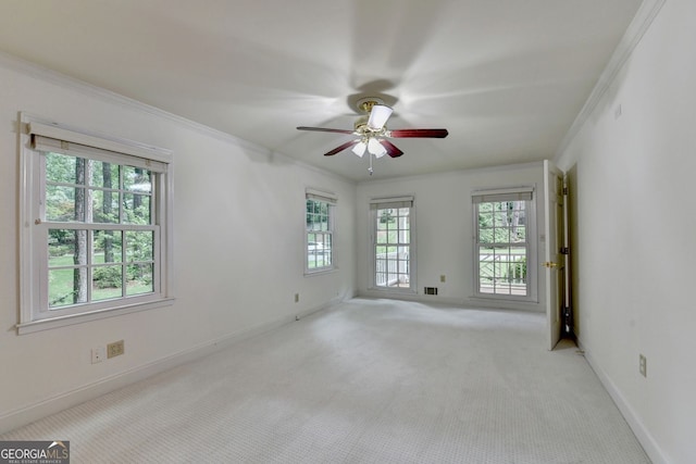 5507 Martina Way, Dunwoody, GA 30338 - empty room featuring crown molding, a ceiling fan, and light carpet