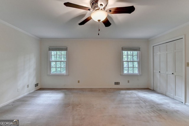 5507 Martina Way, Dunwoody, GA 30338 - unfurnished bedroom featuring ornamental molding, multiple windows, light colored carpet, and ceiling fan