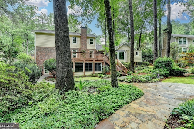 5507 Martina Way, Dunwoody, GA 30338 - back of property featuring stairway, brick siding, a deck, and a chimney