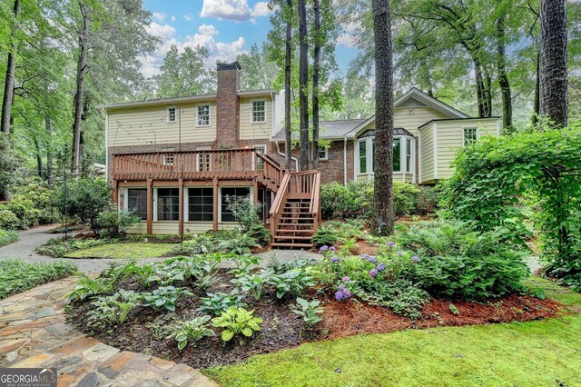 5507 Martina Way, Dunwoody, GA 30338 - back of property with stairway, a deck, a chimney, and brick siding